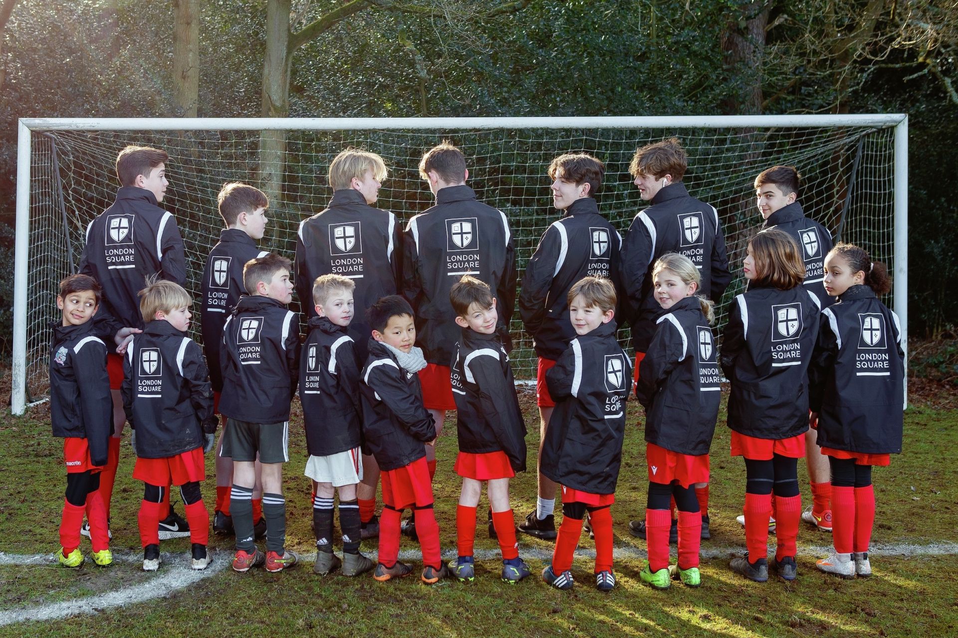 Walton and Hersham Youth Football Club show off their new club jackets